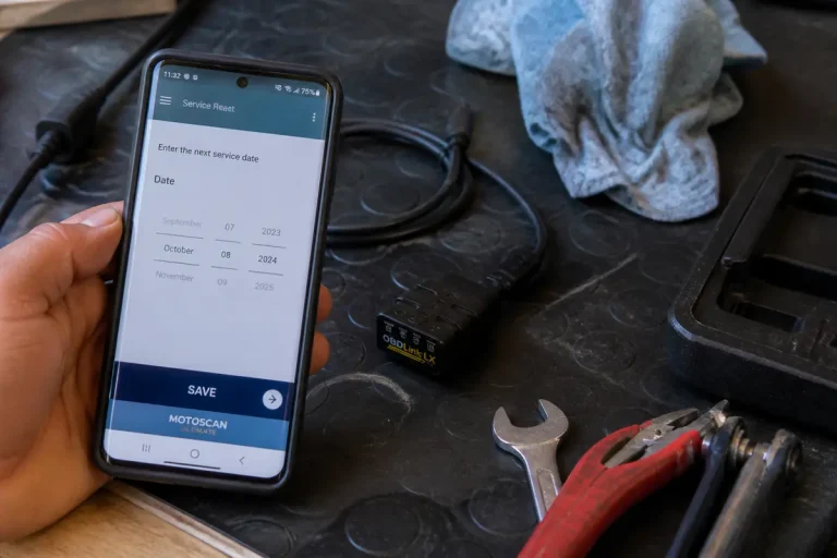Application pour changer la date de révision avec Motoscan BMW affichée sur smartphone atelier